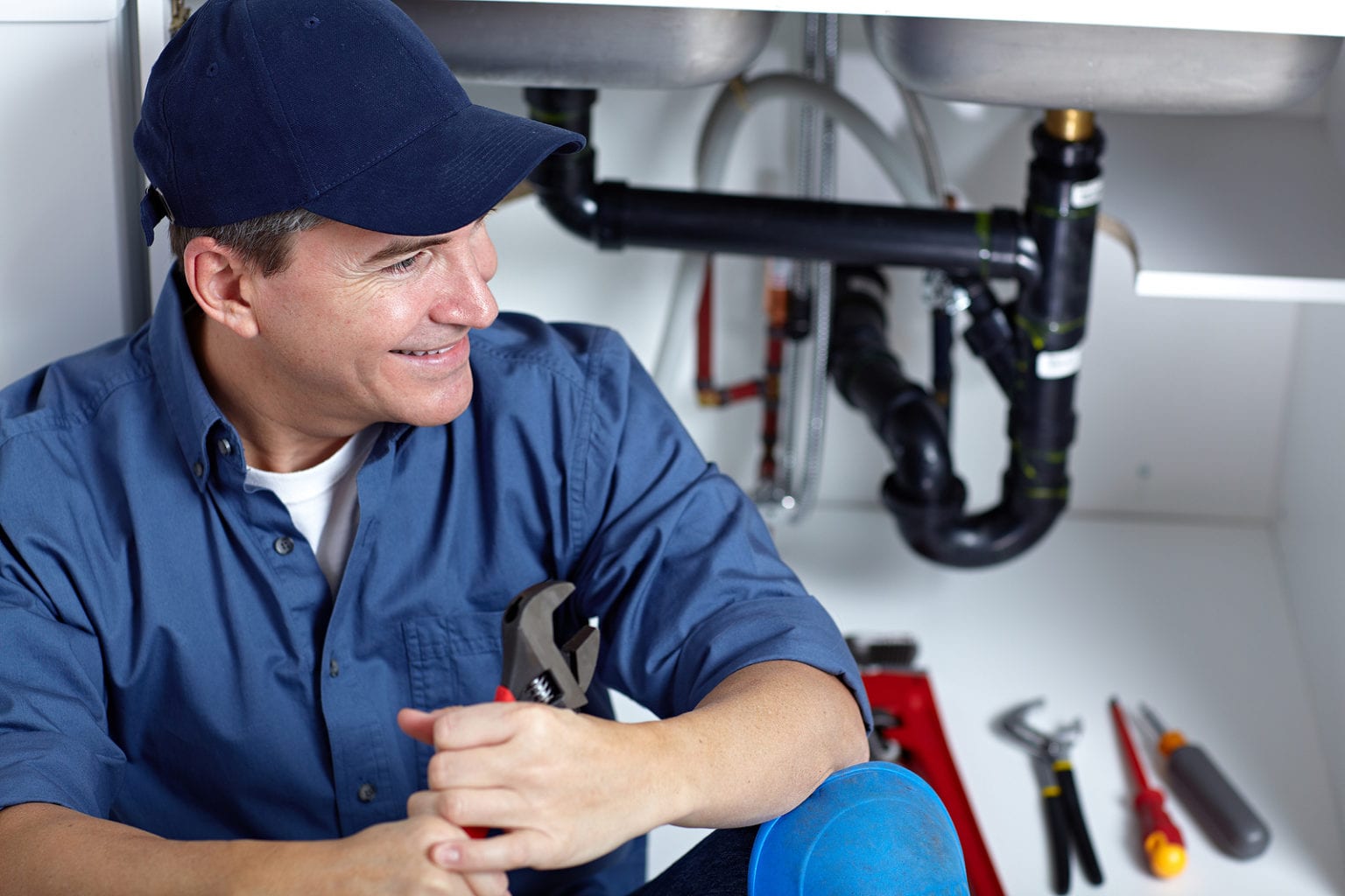 images/bigstock-Smiling-plumber-repairs-a-sink-290706658-1536x1024.jpg